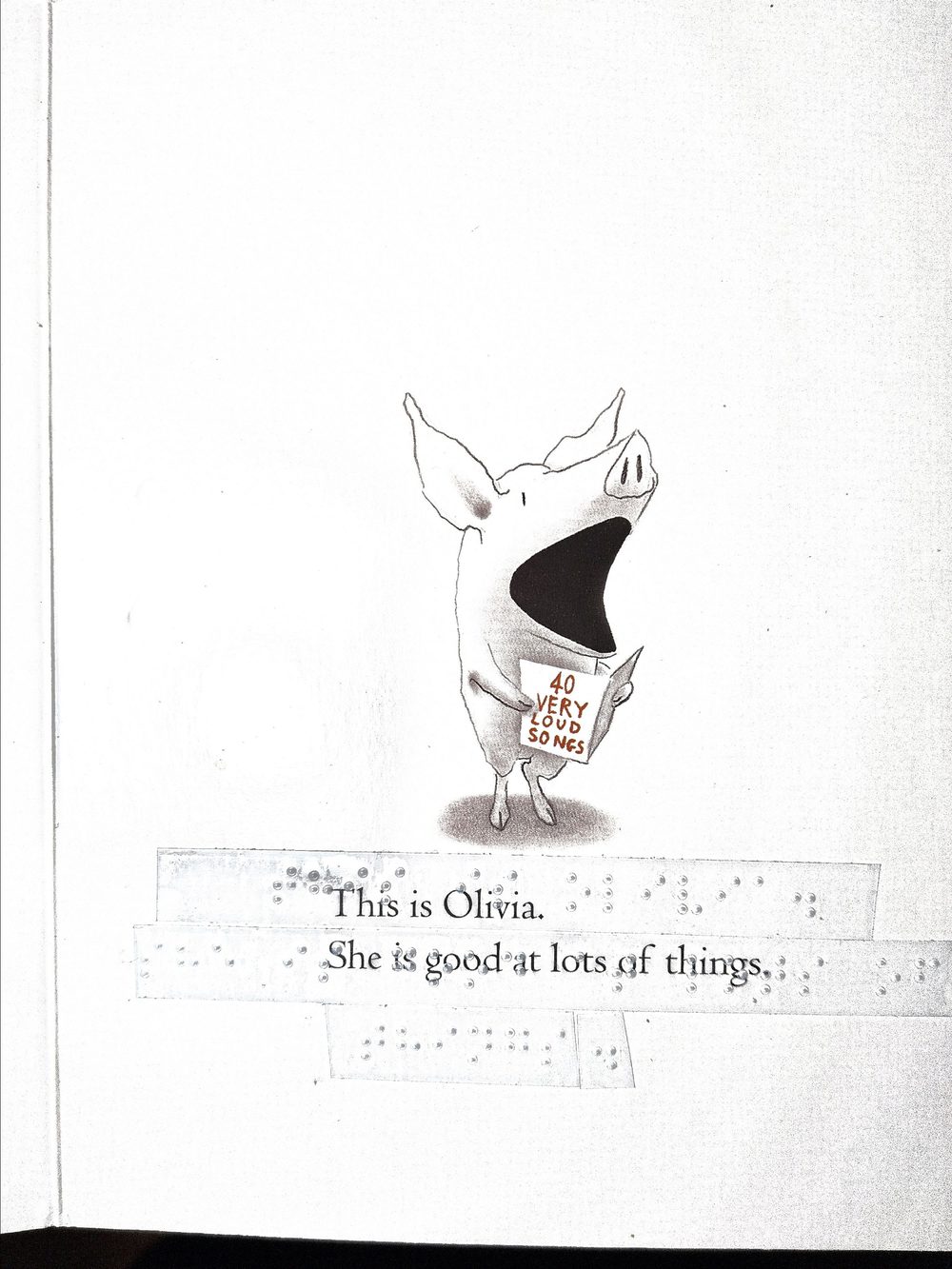 A page from the children's picture book Olivia, with a transparent Braille strip affixed over the printed text reading 'This is Olivia. She is good at lots of things.'